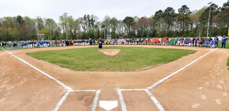 Milton Little League President Tony Willey speaks to the teams, families and fans gathered for the 2024 opening-day ceremonies on Dr. Tobin Field. DAN COOK PHOTO